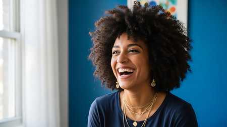 Portrait of beautiful african american woman with afro hairstyle smilingの素材