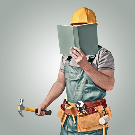 construction worker with a tool belt and book