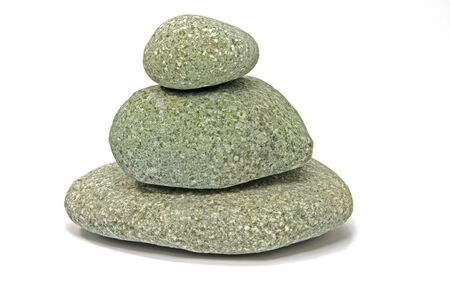 Pyramid made of stones isolated on white の写真素材