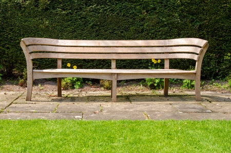 Empty wooden park benchの写真素材