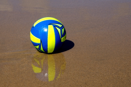 Volleyball on wet sandの写真素材
