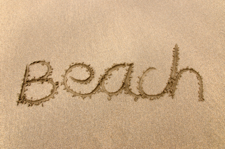 Beach written in sandの写真素材