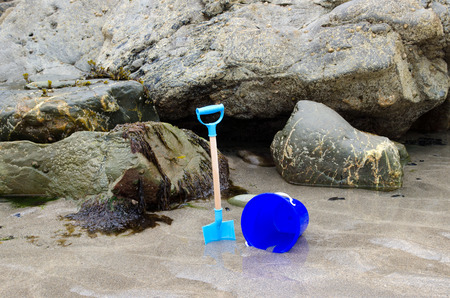 Child s bucket and spade on a beachの写真素材