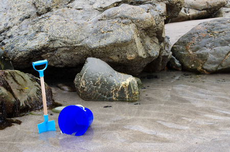 Child s bucket and spade on a beachの写真素材