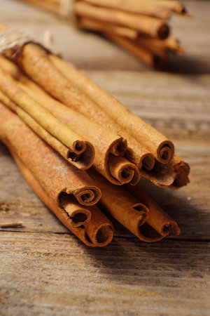 cinnamon sticks on wooden background