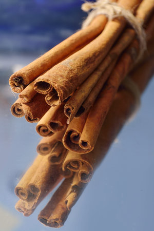 cinnamon sticks on wooden background