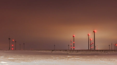 Wind farm in the night with red signal lightsの写真素材
