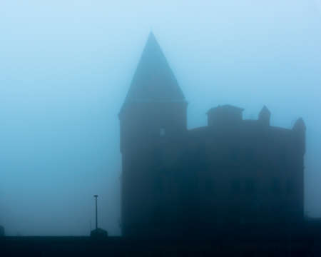 The single white window in a gloomy houseの写真素材