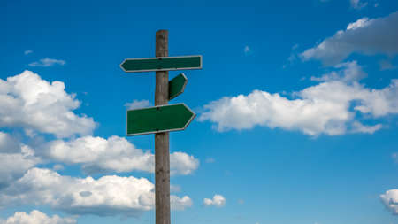 the direction sign with clouds backgroundの写真素材