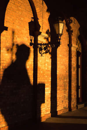The shadow moves towards the old doorの写真素材