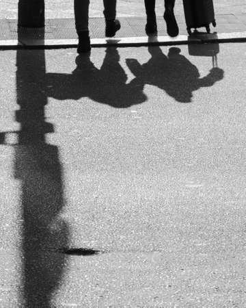 The pedestrians meet each day on the curbの写真素材