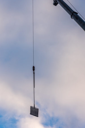 The railing at the hook of the crane