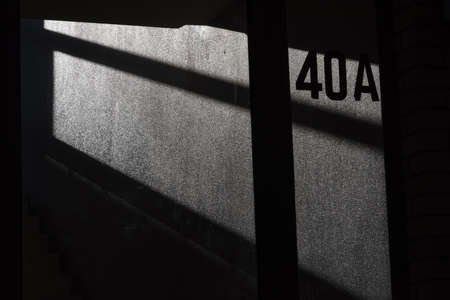 The 40A on the house wall in light and shadowの写真素材