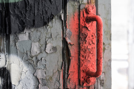 The red old door handle in the uncertainの写真素材
