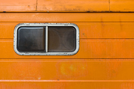The orange old caravan with the plastic window