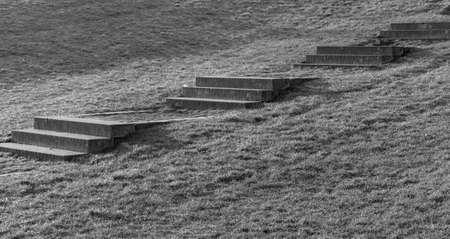 The stairs made of concrete lead up the hillの写真素材