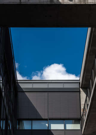 In the courtyard of a modern building with sky view with a cloudの写真素材