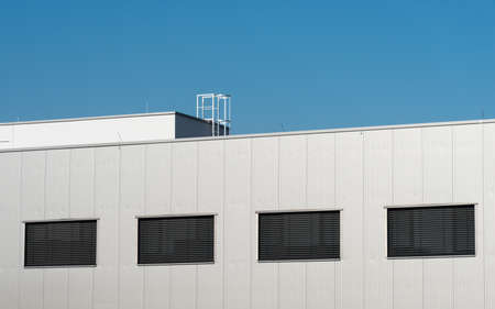 Ladder on the roof of a modern houseの写真素材