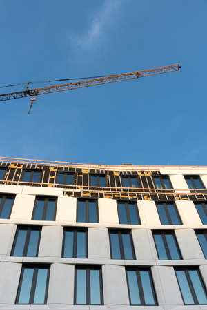 Construction site with crane in the construction of a modern buildingの写真素材