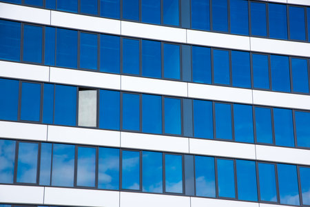 A glass facade with an open window