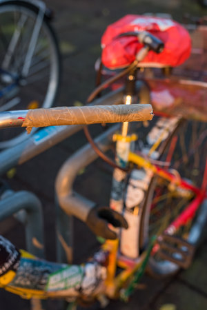 Temporary handle on the handlebar of a worn bikeの写真素材