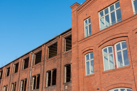 An old brick house is renovated at halfの写真素材