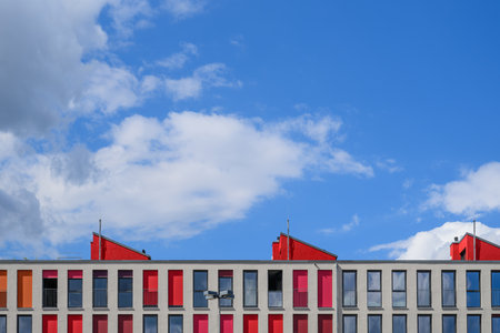 The roof of a modern house with blue sky and cloudsの写真素材