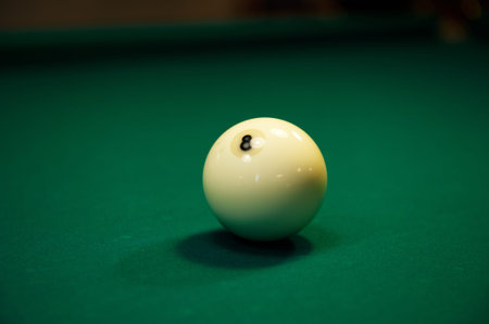 Billiard sphere number eight on a green billiard table