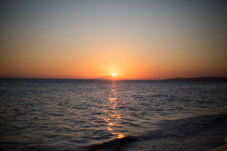 Panorama of beautiful sunset on the ocean.の写真素材