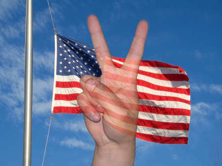 This is a crisp shot of the American flag and the peace sign.の写真素材