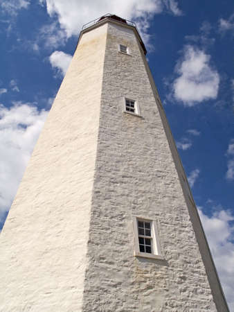 This is a historic lighthouse in Sandy Hook NJ, which dates back to the 1700's.の写真素材