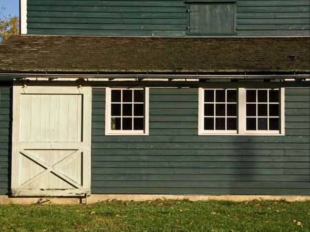 The side of a old barn showing nice color and texture.の写真素材