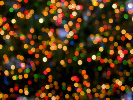 An abstract holiday background of colorful Christmas lights.の写真素材