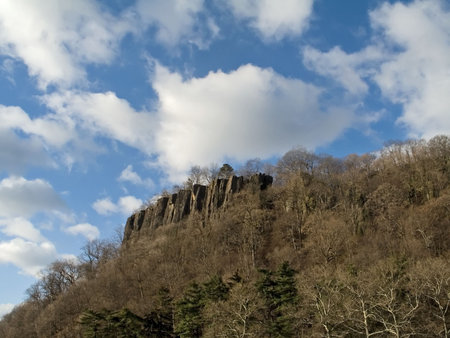 A view of the cliffs at Palisades Interstate Park in New Jersey with a dramatic sky.