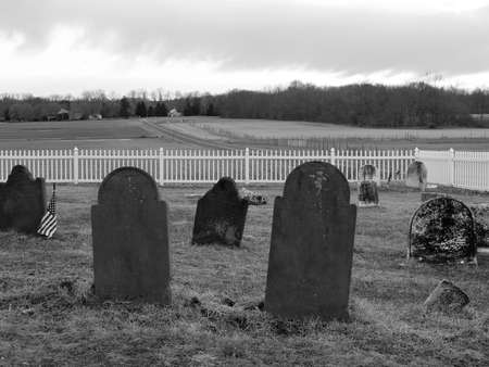 A black and white photo of an historic old graveyard in Holmdel New Jersey.の写真素材