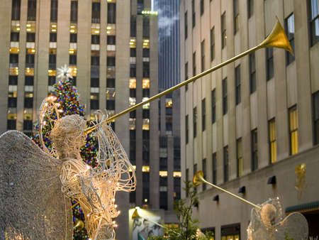 The famous Rockefeller Center Christmas tree with angels framing the shot.のeditorial素材