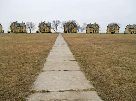 A row of turn of the 20th century yellow brick homes was part of the Barracks of Fort Hancock on Sandy Hook, along the Jersey shore.の写真素材