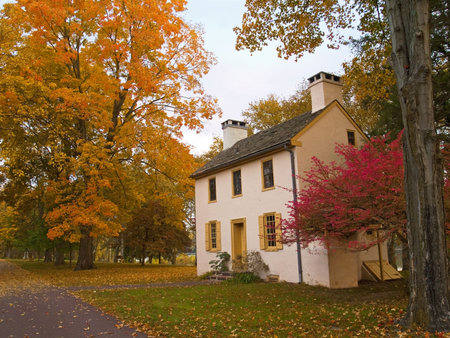 A colonial building in an Autumn setting at Washington Crossing State Park in Pennsylvania.