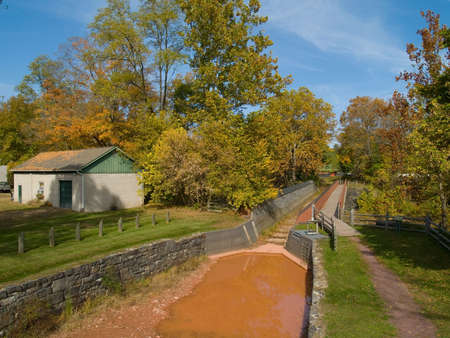 An Autumn view of a historic dike located in Bucks County, Pennsylvania.の写真素材