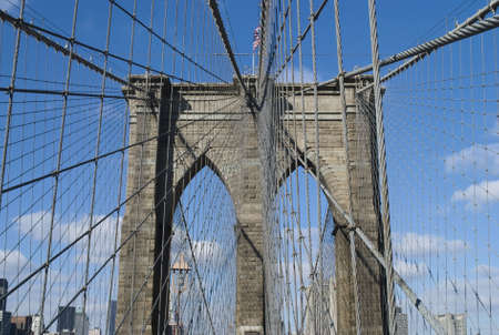 A close-up view of the detail and cable supports of the Brooklyn Bridge. の写真素材