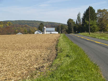 A country road near farmland in Bucks county, Pennsylvania.の写真素材