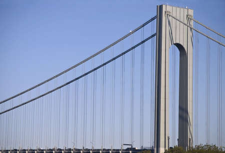 The support cables and one of the main towers of the Verrazano Narrows Bridge which connects Staten Island to Brooklyn in New York City.の写真素材