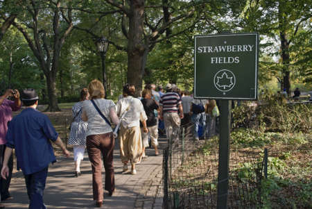 MANHATTAN - OCTOBER 7: Tourists visit Strawberry Fields in Central Park to commemorate John Lennon's 70th Birthday on October 9th, 2010.のeditorial素材