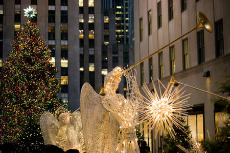 MANHATTAN - DECEMBER 3:  The Rockefeller Center Christmas tree and angel with horn decoration as seen on December 3, 2010 in New York City.のeditorial素材