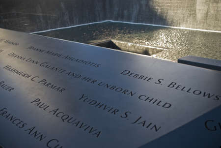 NEW YORK - OCTOBER 6: Victims of the 9/11 attacks are remembered in the memorial surrounding the waterfalls.のeditorial素材
