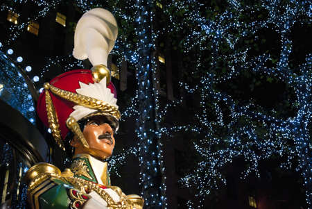 NEW YORK-DEC 2 2011: A Large toy drummer statue and the holiday lights in Rockefeller Center on December 2, 2011.のeditorial素材
