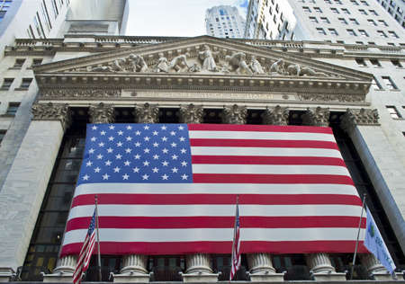 "NY Stock Exchange View"  NEW YORK - SEPTEMBER 24: Large American flag covers the front of the New York Stock Exchange on September 24,2012. It is the worlds largest stock exchange.のeditorial素材