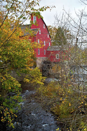 Red Mill Autumn,  A Fall view through the trees of the historic Red Mill in Clinton Township in New Jersey.のeditorial素材