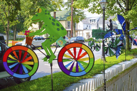 A colorful frog wind spinner outside a country store in the Pocono Mountains of Pennsylvania.のeditorial素材