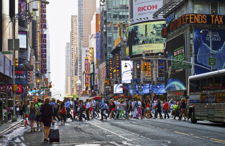NEW YORK - MAY 21: Rush hour crowd in Times Square on May 21 2013 in Manhattan. Times Square is a...